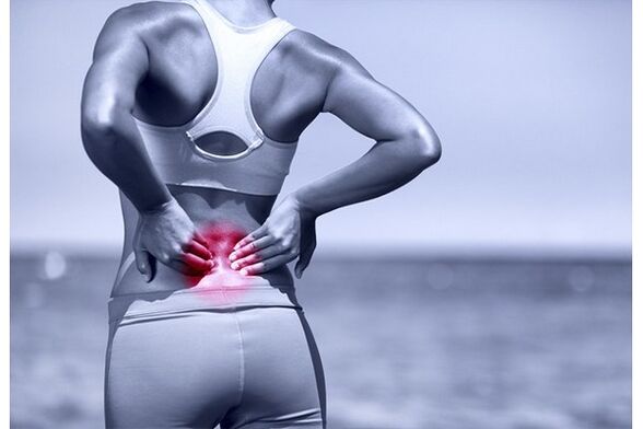 The back in the lumbar region can hurt from excessive exercise